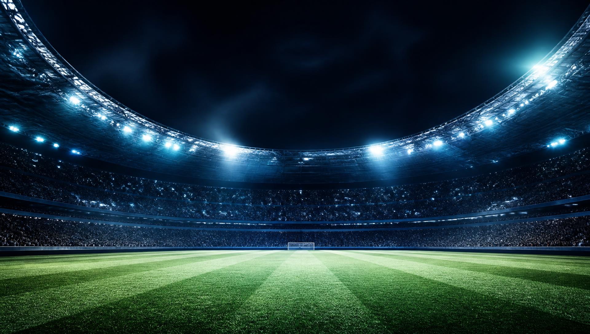 Floodlit European football stadium at night